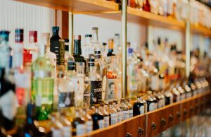 close-up photo of liquor bottles in rack